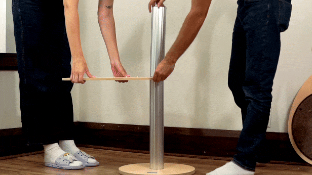 cat tower for large cats being installed with aluminum poles screwed together by hand